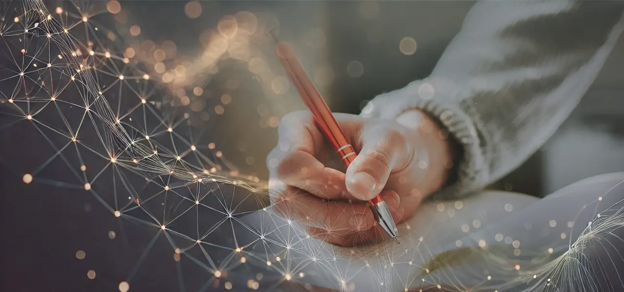 A hand with a pen writing in a notebook, decorated with futuristic lines